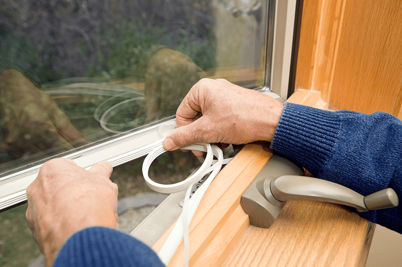5 Common AC Problems. Man repairing window.