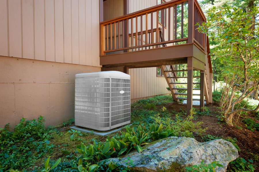 Image of an outdoor heat pump. 4 Factors to Consider When Buying a Heat Pump.