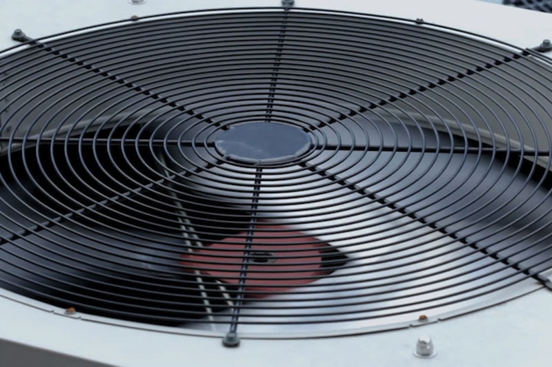 Video - The Importance of Air Conditioner Maintenance. Close up of outside air conditioning unit.