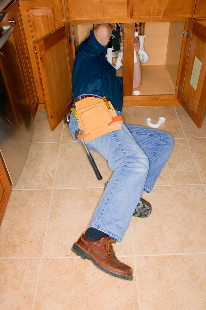 AC Pros plumber repairing home plumbing in Austin, Home